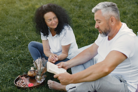 a photo of a male and female reading
