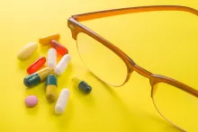 an image of vitamin supplements with yellow background